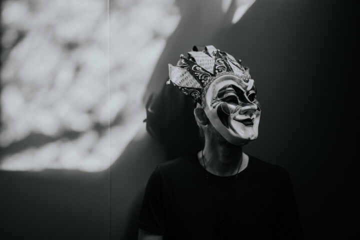 Boris Brejcha black and white press photo with his signature joker mask covering his face.