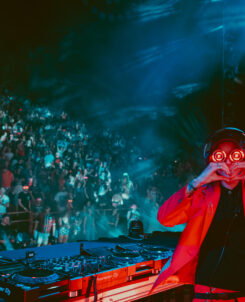 Photo of REZZ throwing up heart sign at Red Rocks
