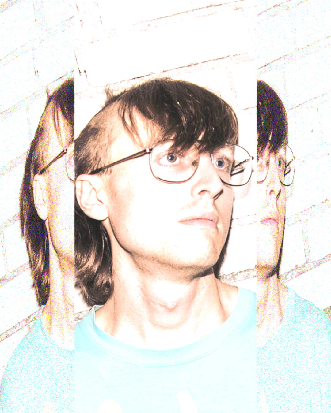 Yheti press shot. Man with big glasses and bangs looking off into the distance.